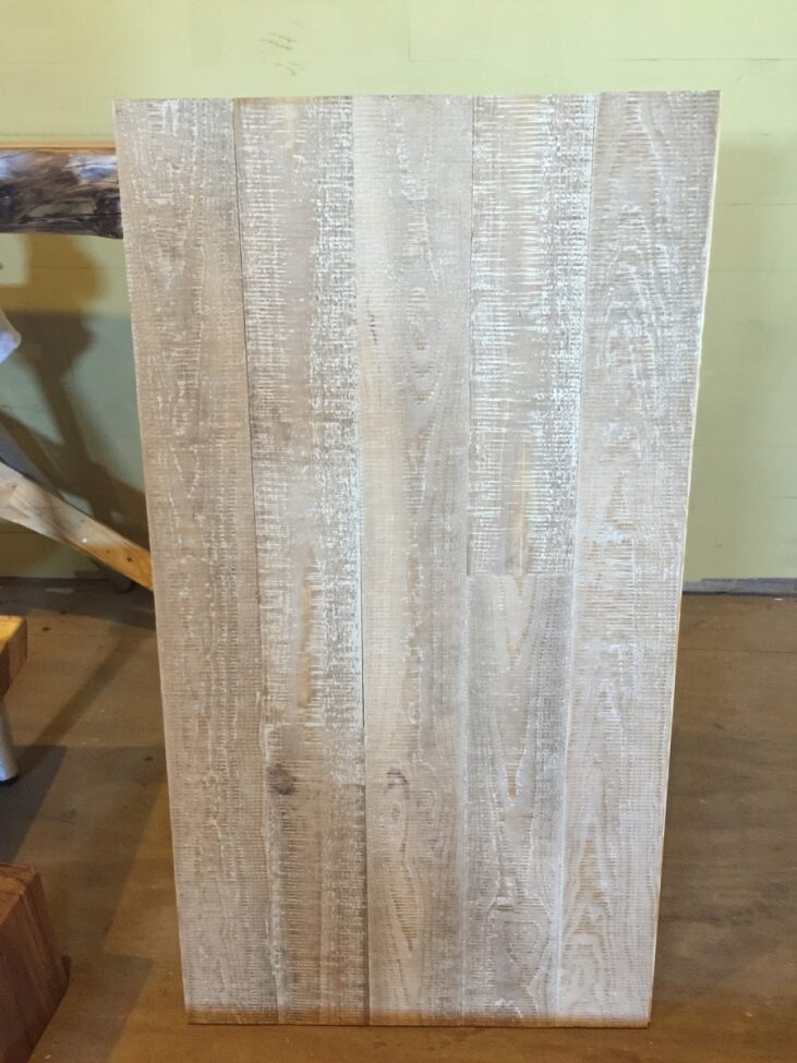 Sample board of white washed white oak beach style flooring