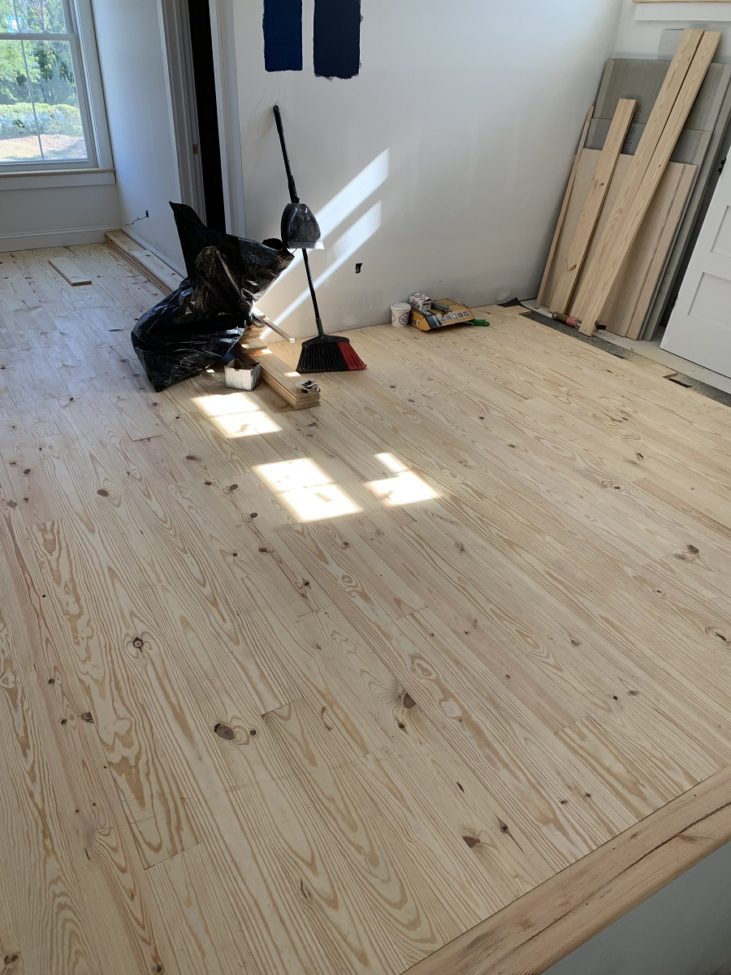 Installing a southern pine floor unfinished waiting to finish with durable stain