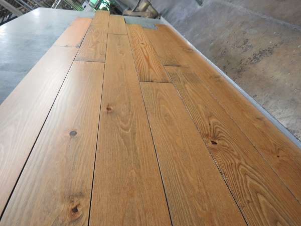 Prefinished southern pine character grade new heart pine with antiqued or darkened edges